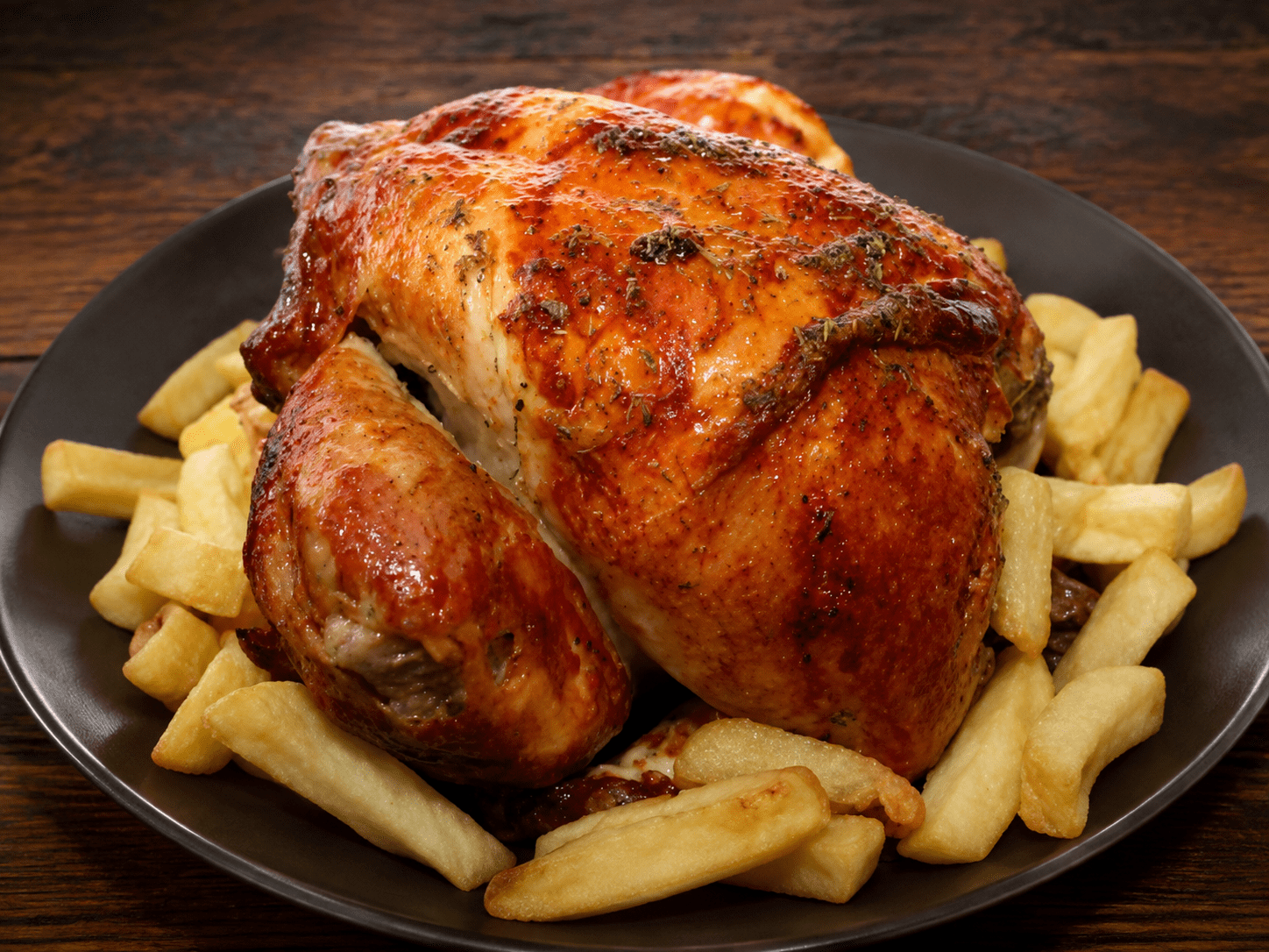 Pollo a l’ast con patatas fritas en Lleida